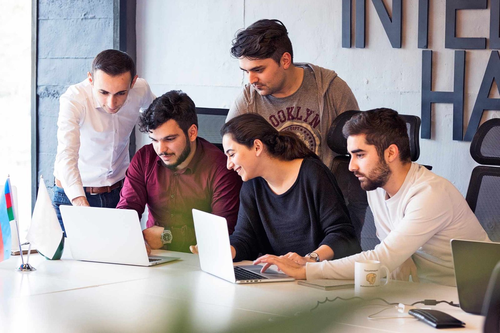 Corporate team creating high-end presentations with an AI video generator.